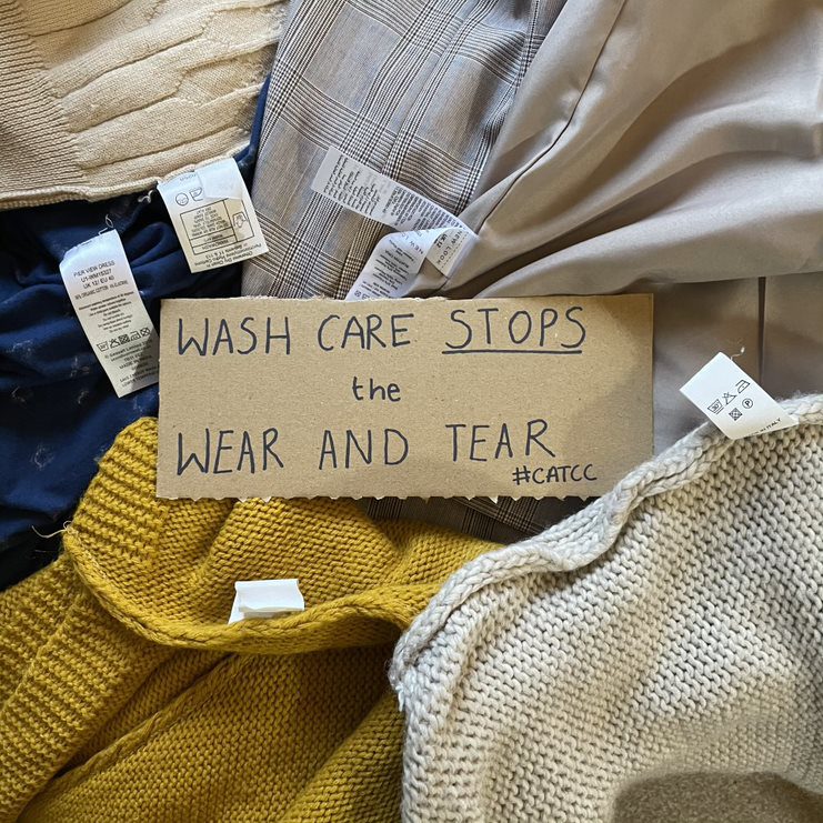 Showing wash care tabs on different clothing with the sign: Wash care stops the wear and tear