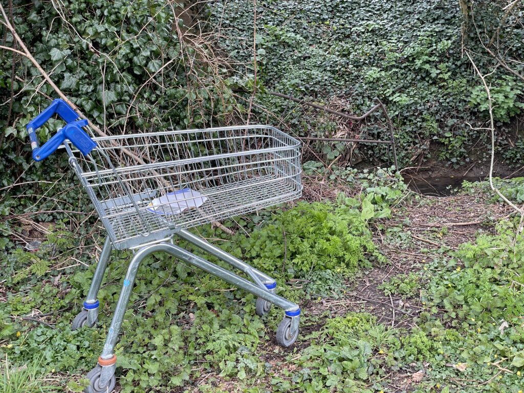 Abandonned shopping trolley next to Duck Brook