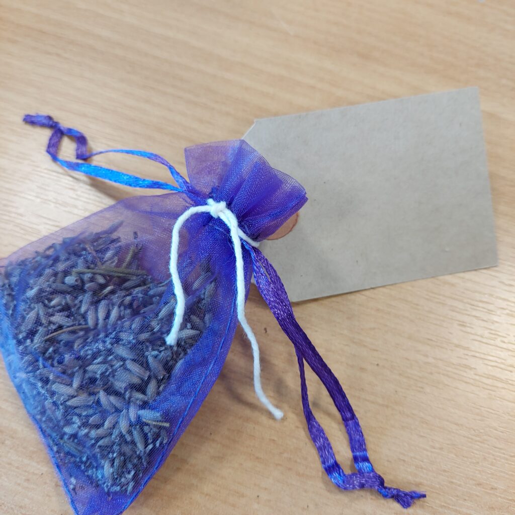 Lavender Bag One purple organza dreid lavender bag with brown card label